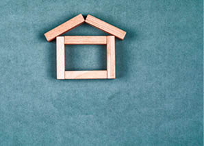 Renting house concept with wooden blocks, sticky note on grey background flat lay 