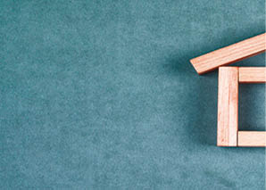 Renting house concept with wooden blocks, sticky note on grey background flat lay 